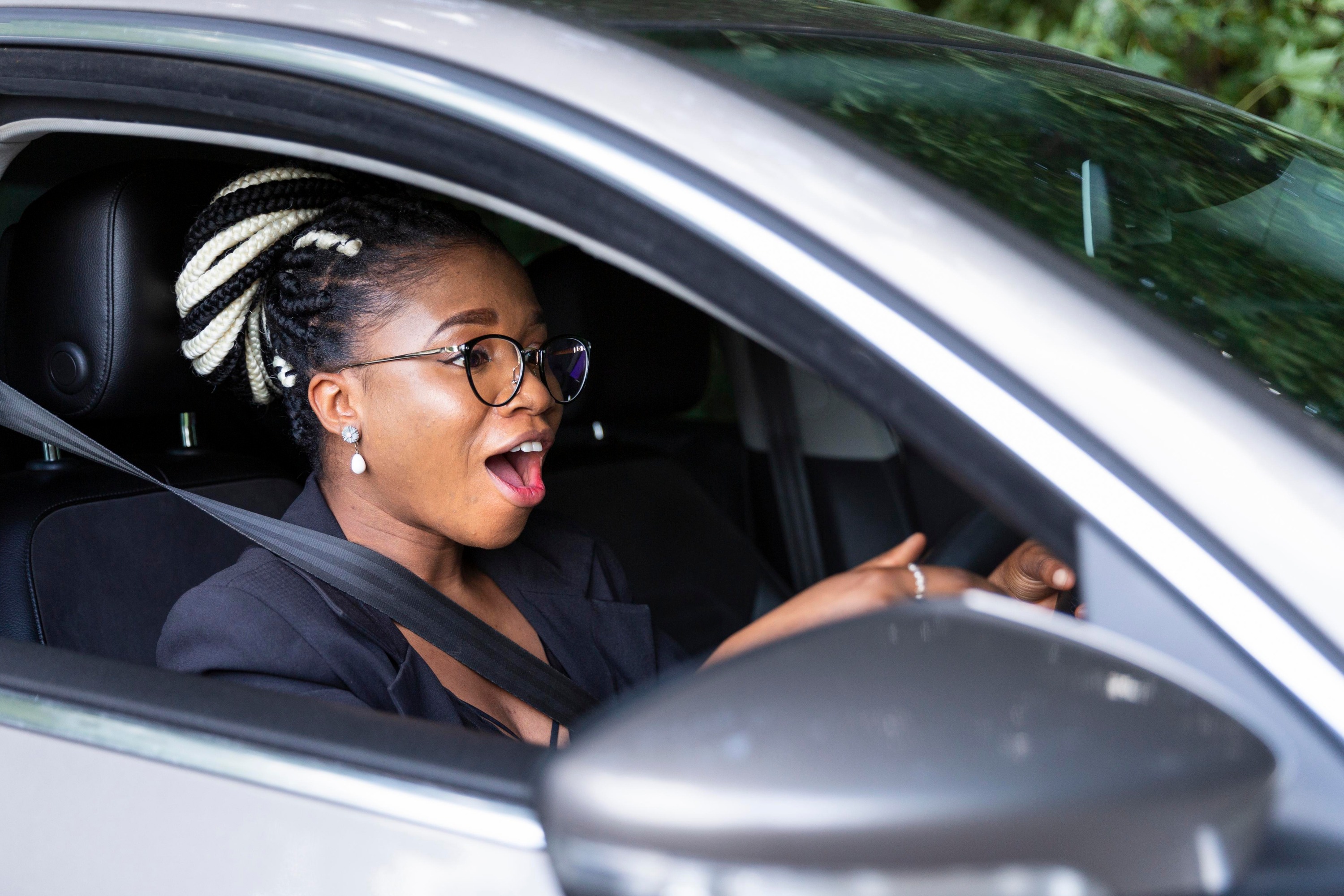 side-view-woman-excited-drive-her-personal-car_edited